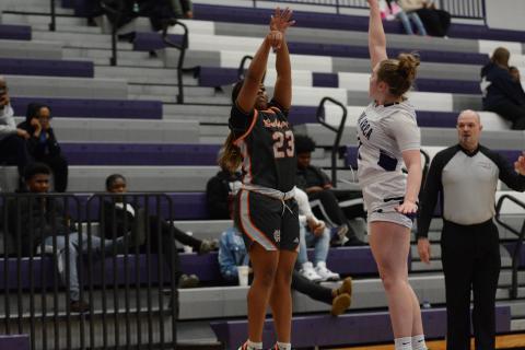 Junior guard TK Smith drills a three pointer over a Lady Hurricane, as she scored nine points, and led the team with seven rebounds and two assists in the 62-20 win over the Lady Hurricanes of Monroe Area on Jan. 10. 