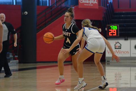 Senior guard Dakota Phillips dribbles the ball up the court against Oconee on Feb. 14.