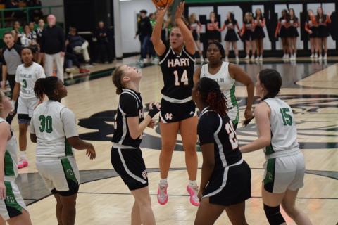 Senior guard Dakota Phillips (14) knocks down a jumper as she set a school record for the most three pointers made in a single game with nine, as she finished with 31 points in the win. Photo by Shane Scoggins/Franklin County Citizen Leader