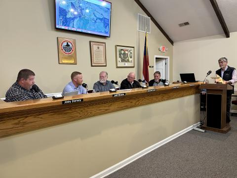 The Board of Commissioners speaking with Terrell Partain, county administrator, at their meeting Feb. 27. 