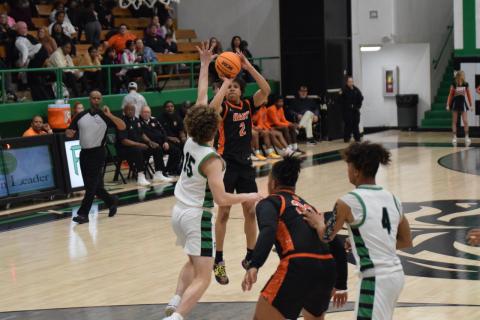 Junior guard O’Brian Evans knocks down a three to help give Hart County the late lead in the 61-55 road win over the Lions of Franklin County on Feb. 9 to secure the No. 2 seed heading into the region tournament. Photo by Shane Scoggins/Franklin County Citizen Leader