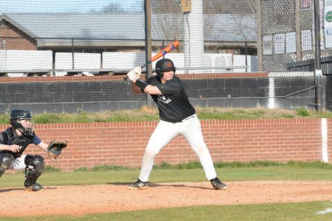 Pictured is senior infielder Owen Kesler awaits the pitch during practice.