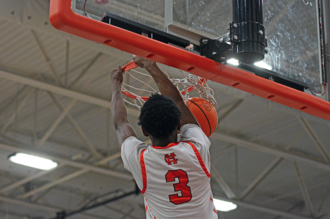 Junior guard Andrew Maxwell slams it home in the final minutes of the 80-45 home win over the Panthers of Carver-Atlanta in first round of the state playoffs on Feb. 21. 