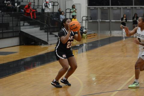 Junior guard TK Smith knocks down seven threes in the 64-44 win over Frederick Douglass High School on Feb. 20. 