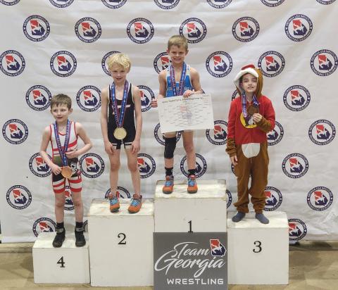 Knox Payne (pictured third from left) claimed back-to-back state championships at the Georgia Wrestling State Championship on March 3 in Perry, Ga. 