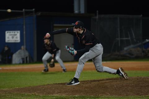 Senior pitcher Avery Strickland delivers the pitch in the 10-4 win over Elbert County on Feb. 19, as Strickland has committed and signed to play baseball at Newberry College. 