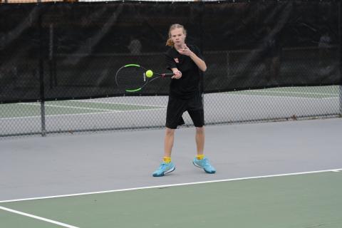 Robert Floyd returns a serve as he won his No. 3 singles match against Elbert, 6-4, 6-2.
