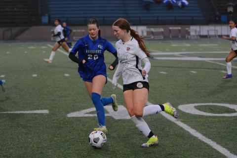 Junior forward Channing Segars dribbles the ball up the sideline in the 8-0 loss to the Lady Warriors of Oconee County. 