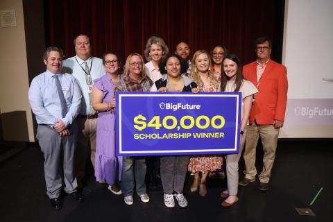 Hart County High School junior Jada Phelps, pictured center, stands alongside her mother, Leanne Phelps, left, as well as Hart County High School administrators, counselors, and College Board representatives after Jada received a $40,000 BigFuture scholarship.