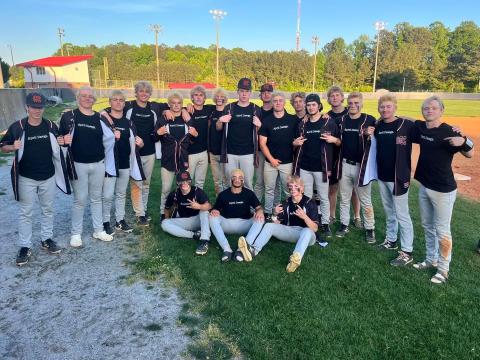 The Hart County High School baseball team shows off their “April Dawgs” shirts after sweeping the Patriots of Sandy Creek on April 23, 9-3 and 12-2, to advance to the Sweet Sixteen.