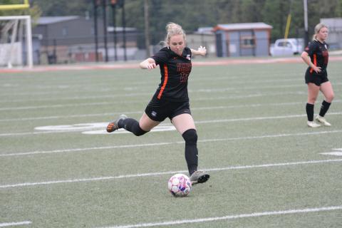 Pictured is junior midfielder Teague Pierce scores the lone goal for the Lady Dogs.