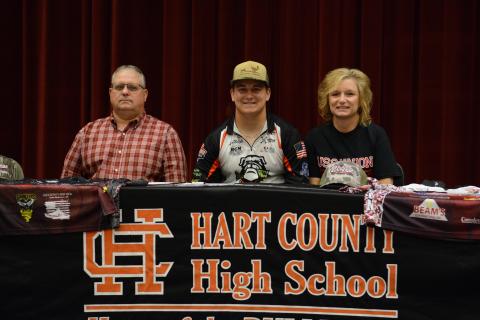 Austin McCall (middle) signs with USC-Union on a fishing scholarship.