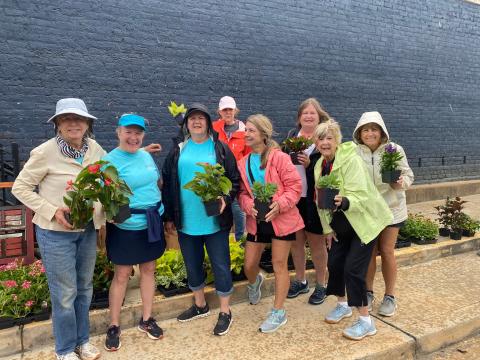 Hartwell Main Street volunteers plant flowers and other shrubbery to beautify the downtown area. 