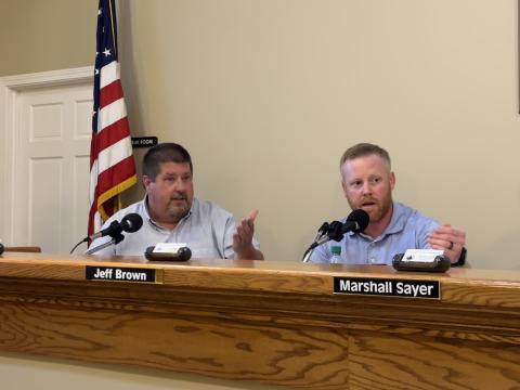 Commissioners Joey Dorsey and Jeff Brown debating an agenda item related to a City of Royston annexation 