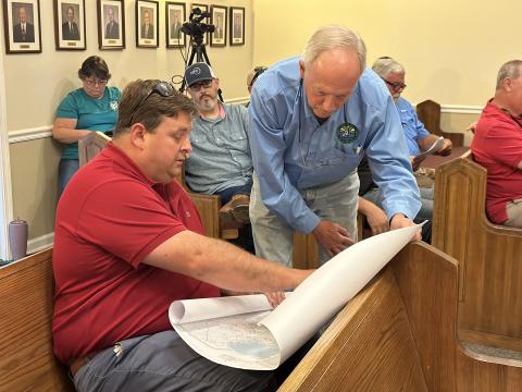 Hartwell city manager Jon Herschell and Hart County Water and Sewer Authority Director Pat Goran looking over a service delivery map.