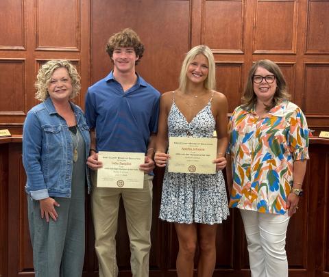 The Board of Education recognized Hart County High School track and field athletes Amelia Johnson and Luke Samples who both won state championships in the pole vault competition. Pictured above: Superintendent Jennifer Carter, Luke Samples, Amelia Johnson, and Board Chair Kim Pierce. 