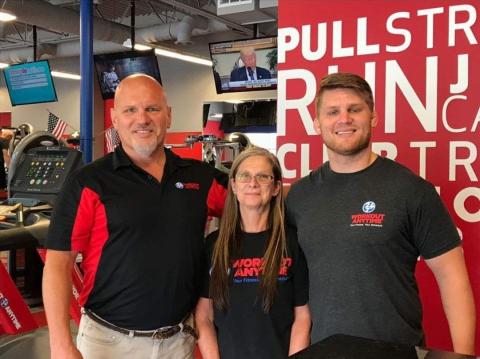 From left to right: Bill, Sheri, and Bret Cesak at one of Workout Anytime’s locations.