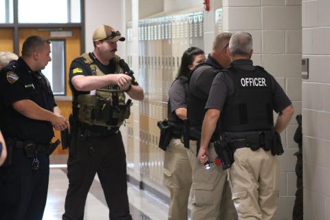 Local law enforcement sweep the building during an active shooter simulation drill at Hart County Middle School.