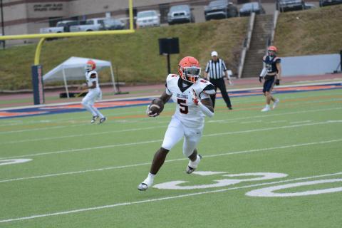 Senior defensive end and tight end Isaac Durrett looks up the field after making the catch in the 2024 Spring Game. 