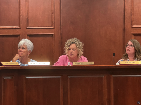 From left to right: Board member Henley Cleary, Superintendent Jennifer Carter, and Board Chair Kim Pierce review amended policy recommendations . 
