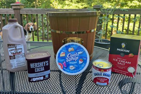 Sparky, the family’s Treeing Walker hound, spies the fixings for Tallulah chocolate on the NeSmiths’ backyard deck in Habersham County. 