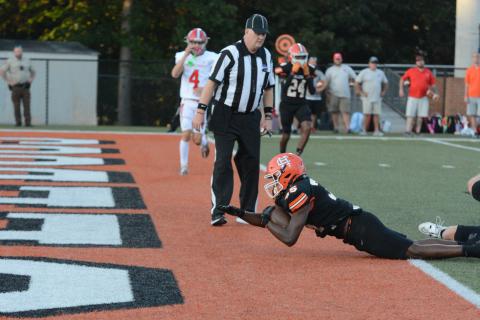 Sophomore running back Faustino Rangel dives in the end zone to give the Dogs an early 6-0 lead in the overtime loss to Madison County, 37-36 at home on Aug. 23.