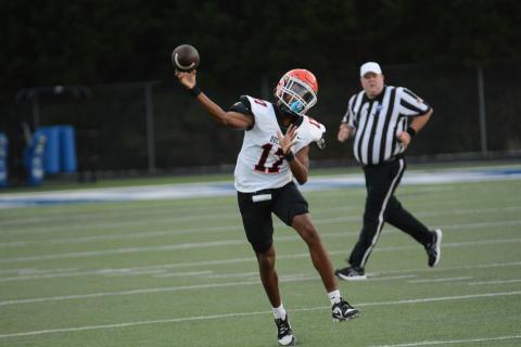 Sophomore quarterback Kurston Curry throws on the run in the 35-10 loss to the Warriors of Oconee County on Aug, 9.