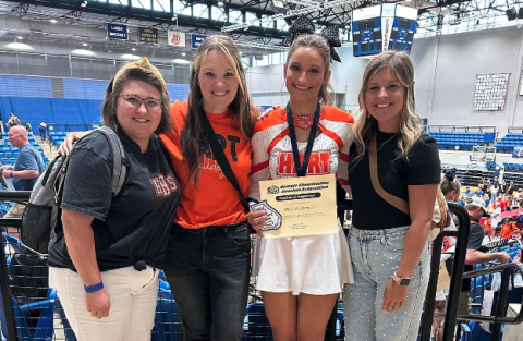 Senior competition cheerleader Bree Dickerson (third one from the left) standa with her coaches after making the All-State team.