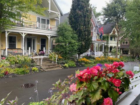 Porches are a prominent feature of homes in Chautauqua. As you walk the tree-lined paths through neighborhoods, you hear lively discussions punctuated with laughter. There is a variety of scheduled “porch chats” on specific topics, but most are impromptu visits among friends—old and new. This photo was taken from the porch of our hosts, Erroll and Elaine Davis. We met in 2008 when Gov. Sonny Perdue appointed me to the Board of Regents and Erroll was chancellor.