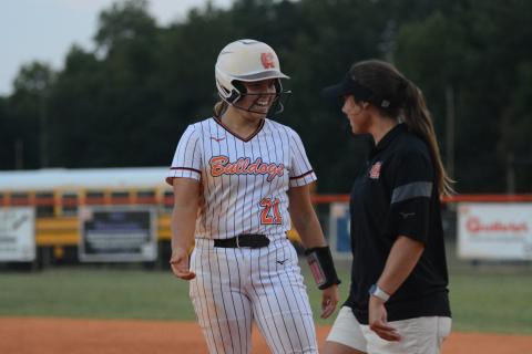 Sophomore pitcher Chesnee Strickland celebrates with assistant coach Meredith Dunn after a base hit on Aug. 29.