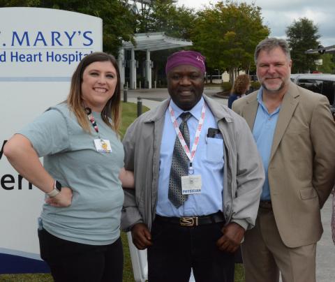 More than 100 healthcare professionals, First Responders and community leaders attended a barbecue sponsored by St. Mary’s Sacred Heart Hospital and Surgical Affiliates Management Group Inc. to celebrate the surgery program’s expansion into elective surgeries. Pictured are (from left) clinic coordinator Ashlee Dove, Dr. Abdul Bangura and David Van Laecke, AMGI vice president of operations. Photo by Charlie Eavenson/Franklin County Citizen