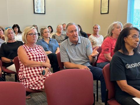 Community members such as Dan Casey attended the Sept. 9 Hartwell City Council meeting to voice concerns about the firing of former Chamber of Commerce Executive Director Lindsey Ingle (located behind Casey, in blue).