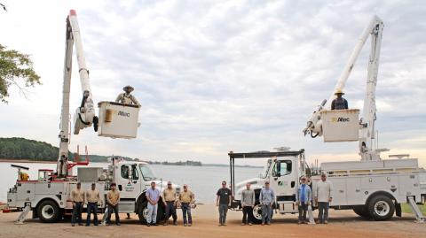Hart County is serviced by two companies  for their electricity needs. On the left, is a crew from Georgia Power including (from left to right): Ethan McCleery (Apprentice lineman), Clarke Looney (supervisor), Freddy Arteaga (apprentice lineman), Jayson Summers(engineer), Mitch Turpin (lineman), Keith Vickery (lineman), and the bucket is Vladimir Flor-Huerta (apprentice lineman). On the right is a crew from Hart EMC including: David Craft, Jared Dove, Sam Findley, Joey Fowler, Caden Hart , and Shaun Martin 