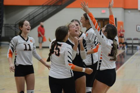 The Volley Dogs celebrate after defeating Westside of Anderson, S.C. in three sets: 27-25, 23-25, and 15-12.