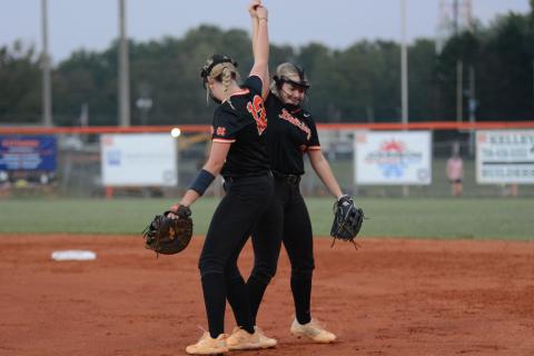 Junior first baseman Kinsley Duncan and sophomore second baseman Carly Dutton celebrates after a 2-0 shutout win over the Lady Tigers of Commerce on Senior Night Sept. 30.