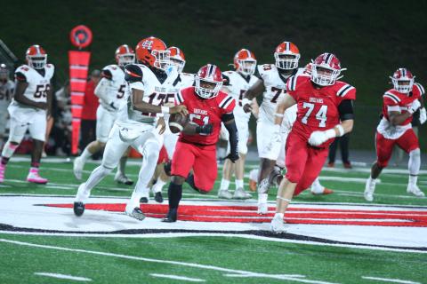 Hart County’s sophomore quarterback Kurston Curry (left) looks to evade the pressure by the Indians defenders in the 37-34 loss to Stephens County on the road on Oct. 25. Photo by Laura Shaw/The Toccoa Record.