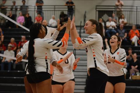 The Volley Dogs celebrate after the 3-1 win over Stephens County in the first round of the Region Tournament Oct. 10.