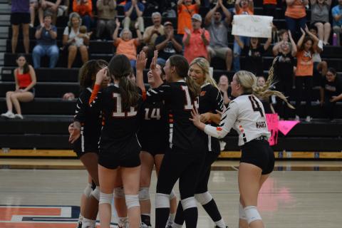 The Volley Dogs celebrate after a 2-0 win (25-21 and 25-19) against Prince Avenue Christian on Oct. 8 to secure a home game in the first round of the region tournament that begins on Oct. 10.