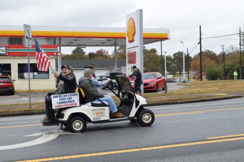 American Legion Post 109 Commander James Fulghum waves the flag during the 2023 Hartwell Veterans Day Parade.