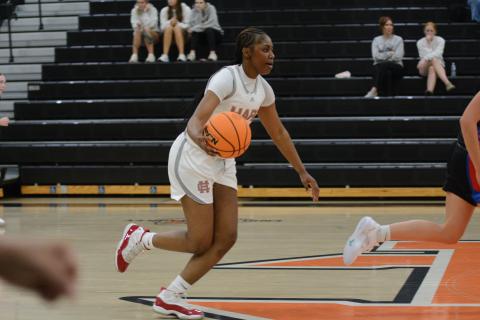 Junior forward Kiasia Montgomery dribbles the ball up the court in the 60-29 win over Oglethorpe County on Nov. 7.