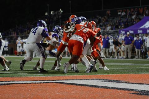 Junior defensive tackle Nicholas Carter (78) sacks the quarterback in the 28-21 win over Monroe Area.