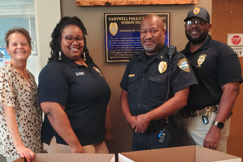 Hartwell Police employees stand next to the Toys for Tots collection boxes. Pictured above (from left to right): Renae Pierce, Roshunda Gaines, Lt. Darin Rucker, and Lt. Sherod Blackwell. 