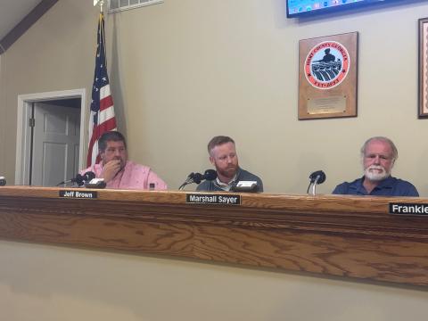 From left to right: Commissioners Joey Dorsey, Jeff Brown and Marshall Sayer listen to citizens regarding recreation department fees. 