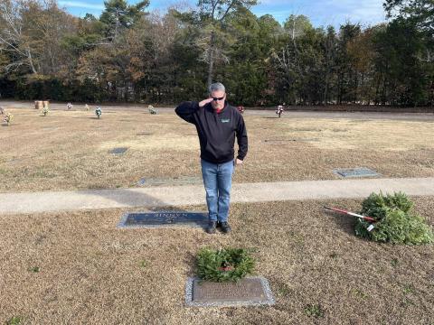 Hartwell volunteer Brian Adams salutes a wreath laid in Nancy Hart Cemetery Dec. 14 during the Wreaths Across America event. 