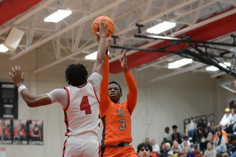 Senior guard Andrew Maxwell gets the tear dropper to go over a Red Raider defender in the 68-61 loss to Madison. 