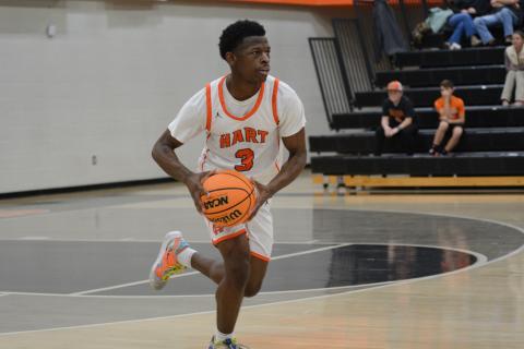 Senior guard Andrew Maxwell looks to pass the ball in the 67-36 win over Athens Academy on Dec. 10.