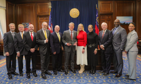 Governor Brian Kemp accepts the award for Georgian of the Year by the Georgia Association of Broadcasters.