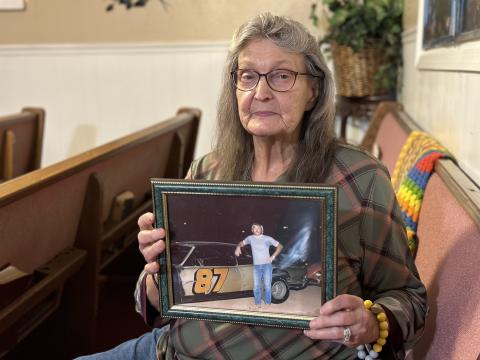 Janice Loggins, one of Frankie Carnes’s sisters, holding a photo of him from around the time he disappeared in the 1970s.