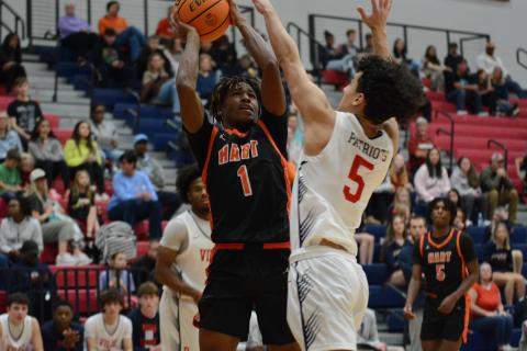 Sophomore guard Kurston Curry goes up for a contested shot.
