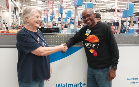 Maurice Jones, Store Manager of Hartwell Walmart presents check to Claudia Kay,  Love Him Love Them Volunteer, in support of the Thanksgiving Day Event.  Over 5,000 meals were prepared and delivered.